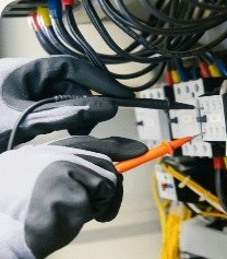 Electrician working on an electrical panel